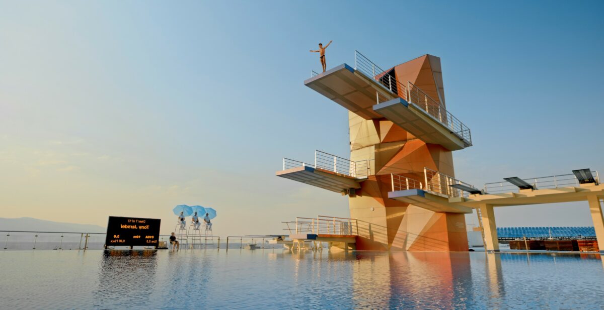 Male diver standing on diving board before jump